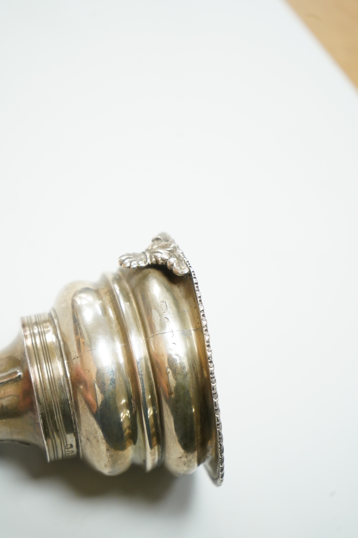 A George III silver wine funnel, with shell thumbpiece, marks rubbed, 14.5cm.